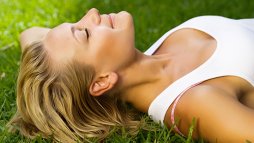 woman sleeping in meadow